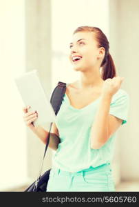 education, technology and internet concept - happy student girl with tablet pc