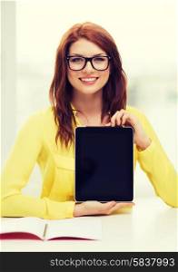 education, technology and internet concept - smiling student girl in eyeglasses with tablet pc at school