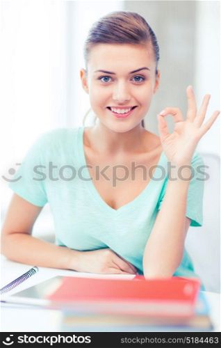 education, technology and internet concept - smiling student girl with tablet pc. smiling student girl with tablet pc
