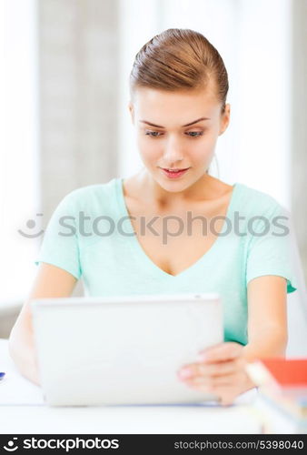 education, technology and internet concept - smiling student girl with tablet pc