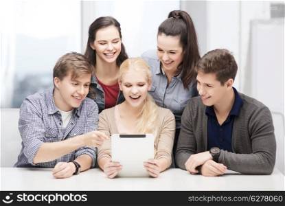 education, technology and internet concept - smiling students with tablet pc at school