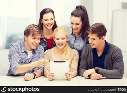 education, technology and internet concept - smiling students with tablet pc computer at school