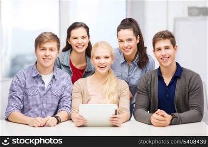 education, technology and internet concept - smiling students with taplet pc computer at school