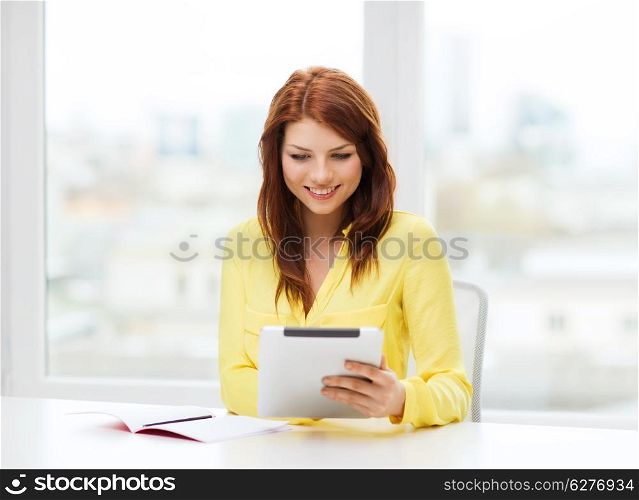education, technology and internet concept - student with tablet pc computer and notebook