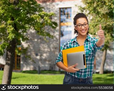 education, technology and people concept - smiling female african american student in eyeglasses with folders and tablet pc