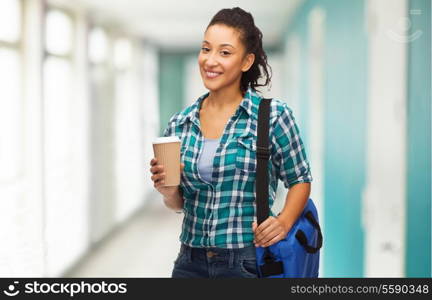 education, technology and people concept - smiling female african american student with bag and take away coffee cup