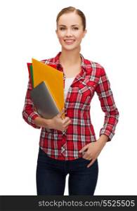 education, technology and people concept - smiling student with folders and tablet pc computer