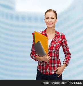 education, technology and people concept - smiling student with folders and tablet pc computer