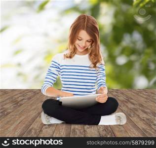 education, technology, childhood and people concept - happy little student girl with tablet pc over greed background