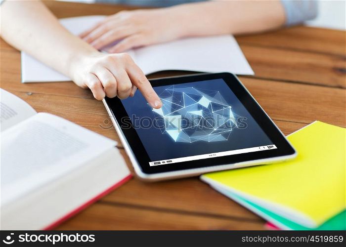education, technology, network and internet concept - close up of student woman with low poly shape on tablet pc computer screen and notebook at home