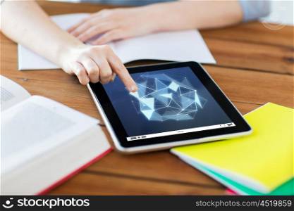education, technology, network and internet concept - close up of student woman with low poly shape on tablet pc computer screen and notebook at home