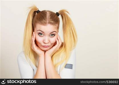 Education, teenage adolescence, happiness concept. Happy blonde teenager student girl with ponytails. Happy blonde teenager girl with ponytails