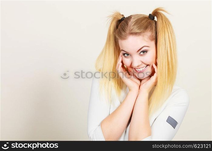Education, teenage adolescence, happiness concept. Happy blonde teenager student girl with ponytails. Happy blonde teenager girl with ponytails