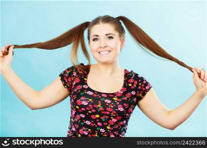 Education, teenage adolescence, happiness concept. Happy teenager student girl with ponytails having fun. Happy teenager girl with ponytails