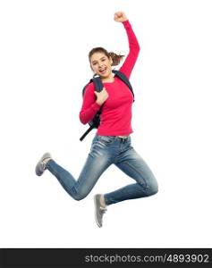 education, travel, tourism, motion and people concept - smiling young woman or student with backpack jumping in air over white background