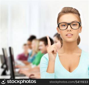 education, vision, optics concept - attractive student or teacher wearing glasses in college