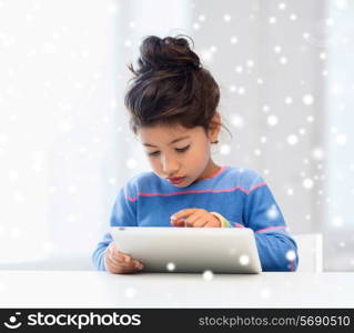 education, winter, technology and people concept - little girl with tablet pc at home