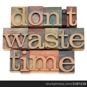 efficiency motivation concept - do not waste time - isolated text in vintage wood printing blocks