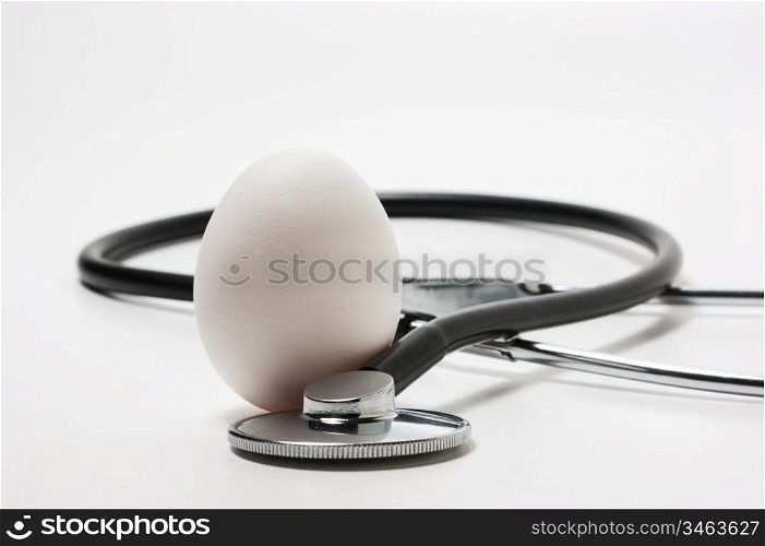 egg and a medical stethoscope