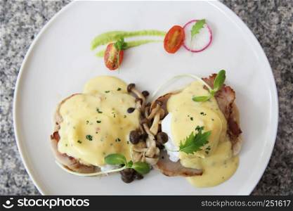 egg benedict with bread and bacon