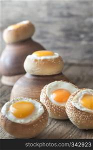 Egg-in-a-hole buns on the wooden board