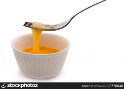 Egg in cup on white background