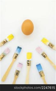 egg near brushes colors