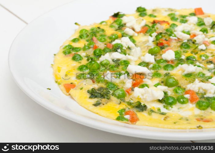 Egg Omelette With Tomatoes, Peas and Feta Cheese