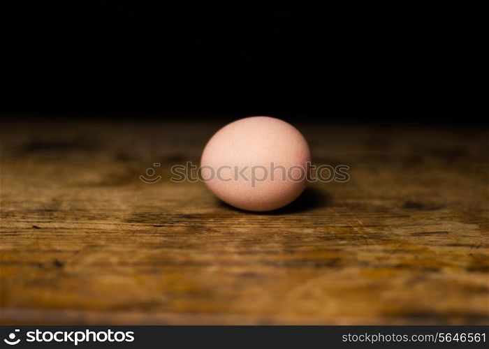 Egg on wooden surface