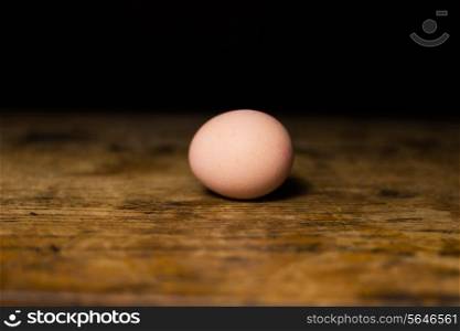 Egg on wooden surface