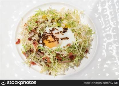 Egg salad with duck confit, groumet French Cuisine