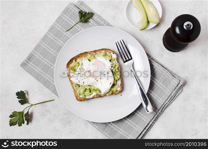 egg with avocado toast plate