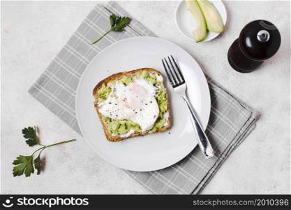 egg with avocado toast plate