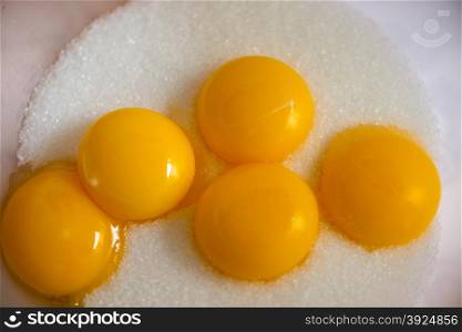 Egg yellow on sugar. Egg yellow on white sugar for baking sweet cookies