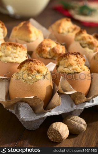 Eggnog cupcakes baked in eggshells, photographed with natural light (Selective Focus, Focus on the front of the first cupcake)