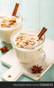 Eggnog. Traditional Christmas drink, spiced egg-milk cocktail with cream caramel topping.