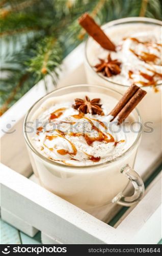 Eggnog. Traditional Christmas drink, spiced egg-milk cocktail with cream caramel topping.