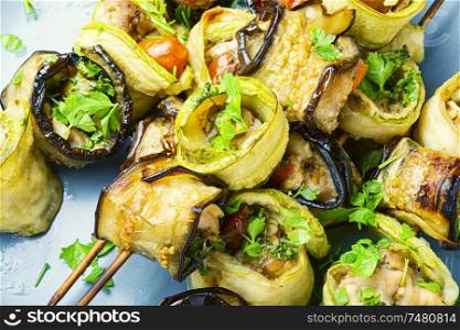 Eggplant and zucchini stuffed with meat on skewers. Eggplant with meat on skewers