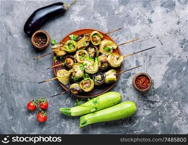 Eggplant and zucchini stuffed with meat on skewers.Flat lay.Vegetarian skewers. Eggplant with meat on skewers