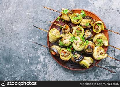 Eggplant and zucchini stuffed with meat on skewers.Grill menu. Eggplant with meat on skewers