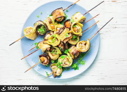 Eggplant and zucchini stuffed with meat on skewers.Vegetarian skewers. Eggplant with meat on skewers