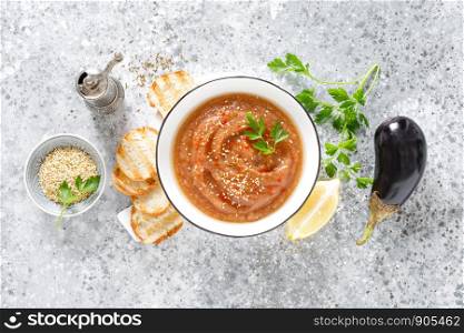 Eggplant hummus with ingredients for cooking. Traditional vegan arabic aubergine appetizer. Baba Ghanoush