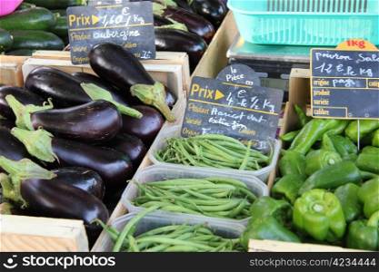 eggplants, beans and peppers at a French market
