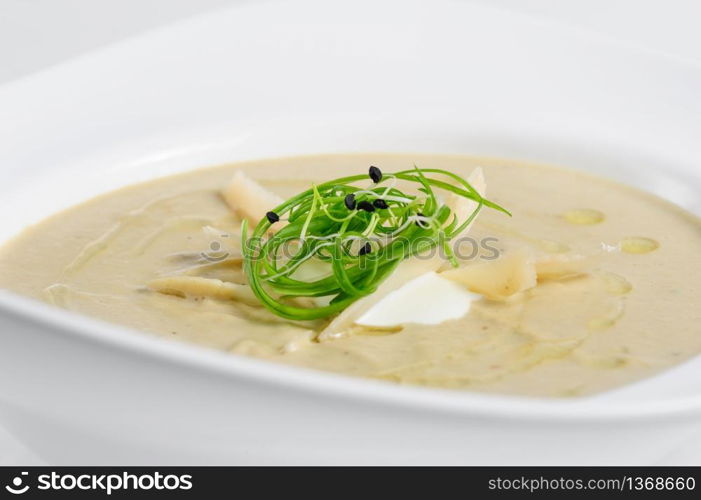 Eggplants cream soup puree with parmigiano and chukka. Eggplants cream soup with parmigiano