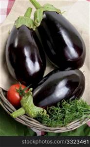 Eggplants of black colour in a basket