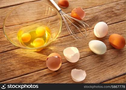 Eggs and shaker on wood with blue easter white and brown egg colors