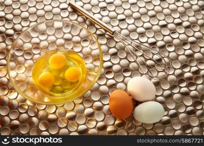 Eggs and shaker with blue easter white and brown egg colors on modern stainless steel