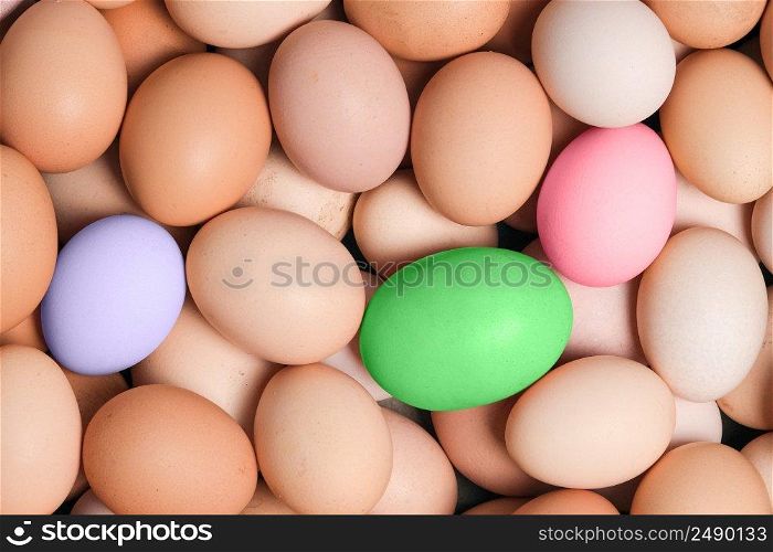Eggs background. Top view, food background. A lot of organic farm eggs close up. Colored Easter eggs.. Eggs background. Top view, food background. A lot of organic farm eggs close up. Colored Easter eggs