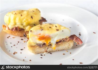 Eggs Benedict on the white plate
