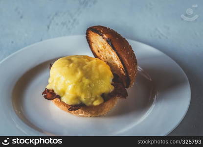 Eggs Benedict on the white plate